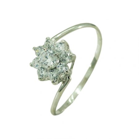 Anillo flor cuajo con 9 circonitas oro blanco 18k