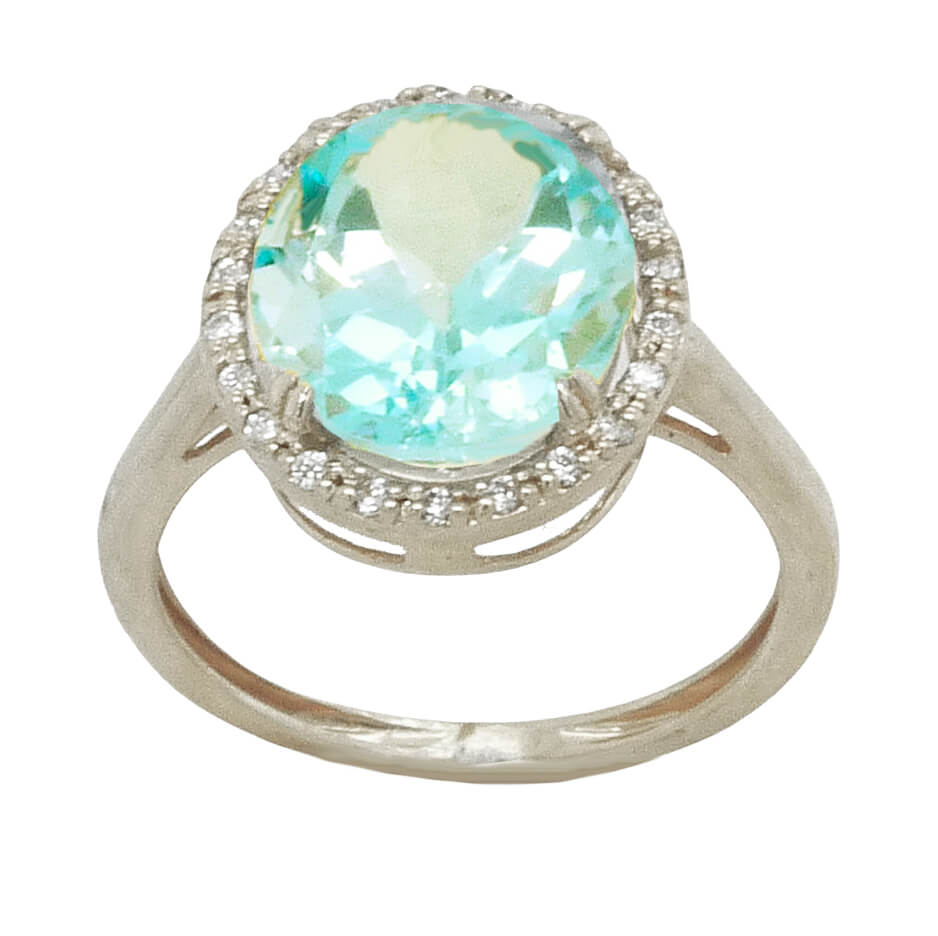Anillo garras con topacio azul oval y circonitas oro blanco 18k