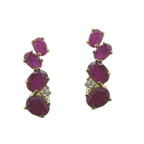 Pendiente largos garras 4 rubíes y diamantes oro 18k