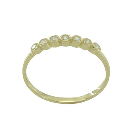 Anillo en brillo espejo con siete circonitas oro 18k