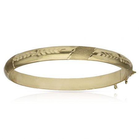 Pulsera media caña tallada de 7mm. oro de 18k